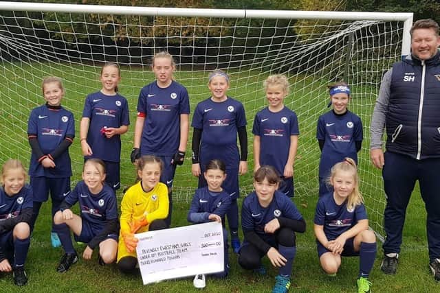 Pevensey and Westham Girls' Under 10s received a donation from police (photo by Sussex Police)