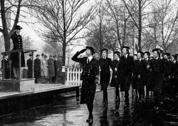 June 1940, The H.R.H. The Duchess of Kent saluting a march past of wrens.