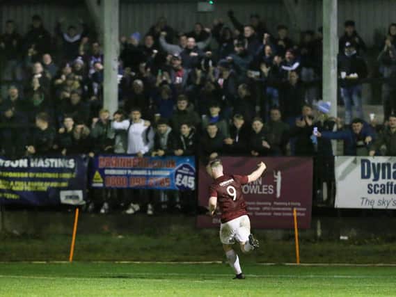 Ben Pope celebrates Hastings' second goal v Whitehawk with the fans - but the club would love to get more than 400 into the Pilot Field / Picture: Scott White