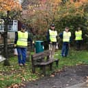 Storrington and Pulborough District Rotary Club members planting crocuses  on World Polio Day at Storrington Memorial Pond SUS-200411-123903001