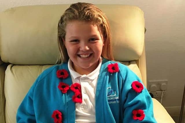 Molly Parkinson, ten, has raised hundreds of pounds for the Royal British Legion with her crocheted poppies