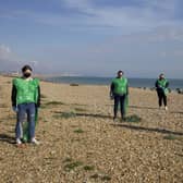 Staff from the restaurant at Holmbush Shopping Centre clearing litter on Shoreham Beach