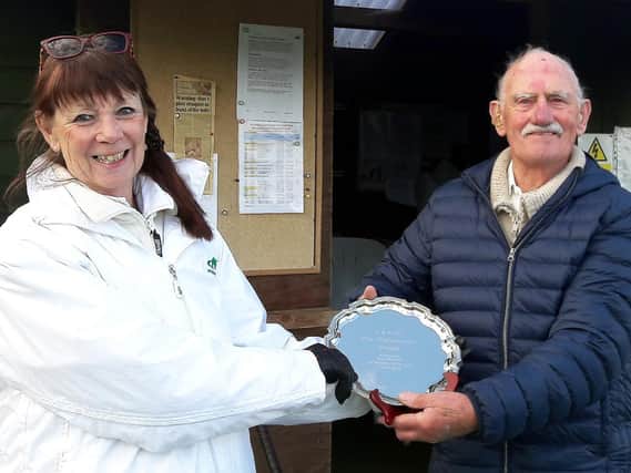 Sally Short receives the trophy from Brian Shipman