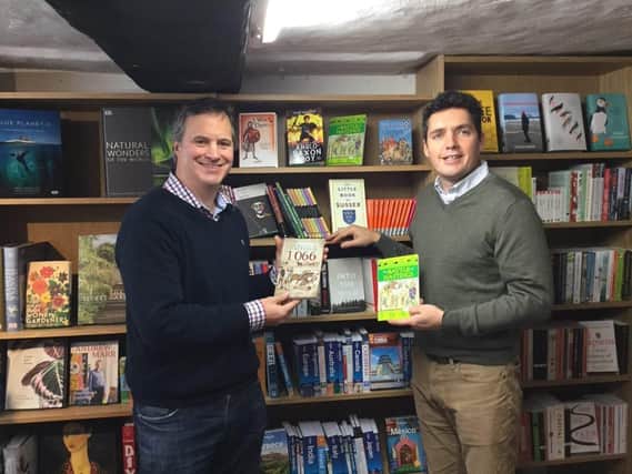 MP Huw Merriman with Ian Cawley at Rother Books. Picture taken before the pandemic SUS-201111-174936001