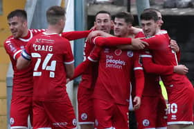 Crawley Town players celebrate with Ashley Nadesan after scoring the winner against Torquay United. Picture courtesy of Crawley Town