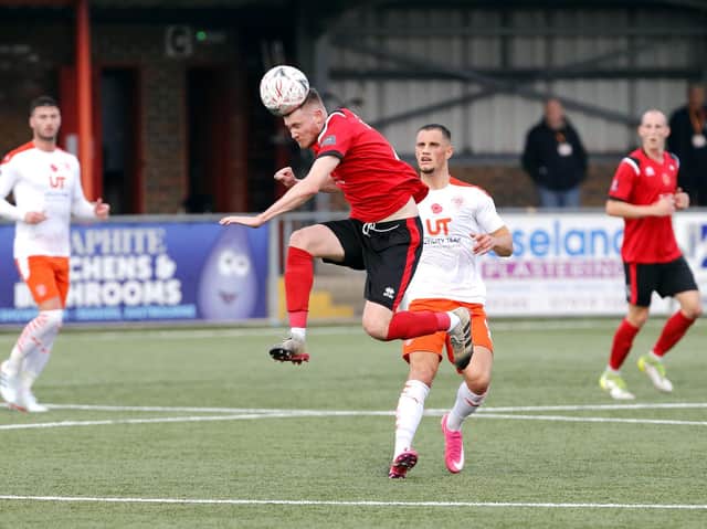 James Ferry gets there first as Eastbourne give Blackpool a run for their money / Picture: Lydia Redman