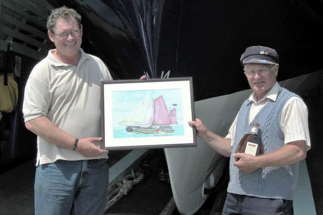 Peter Wells presents George with a painting of the Maaslust in 2006