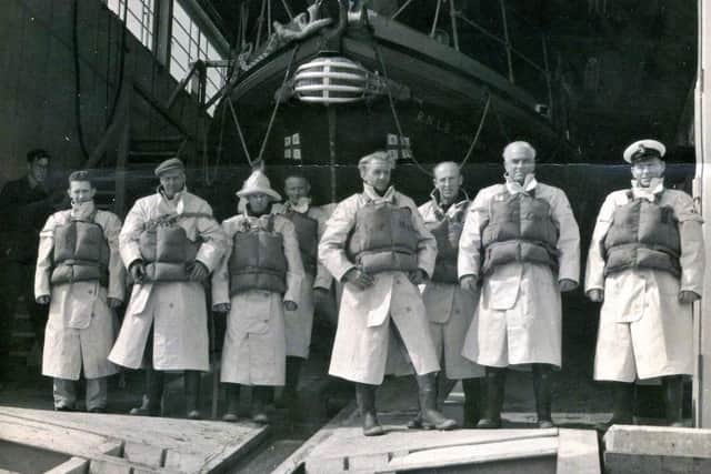 The Canadian Pacific and its crew, with George Woodland wearing Sou'wester, fourth from left