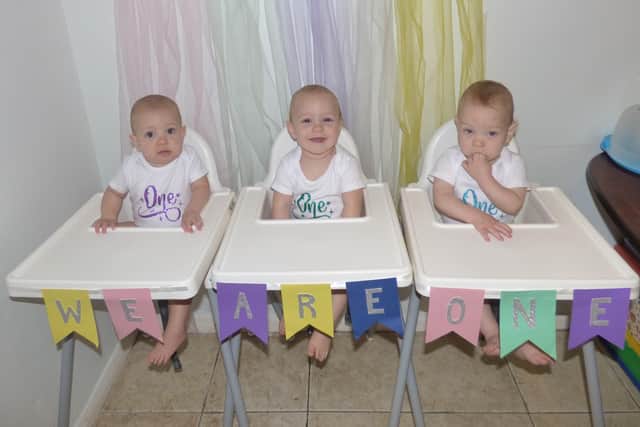 Cheryl Carter and Chris Pegrum from Yapton have triplets: Violet, Frank, and William. Pictured aged one