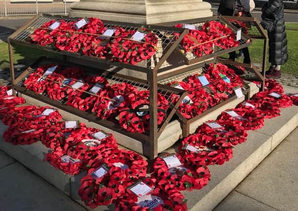 Wreaths at Eastbourne War Memorial. Picture by Eastbourne Borough Council. SUS-200911-104721001