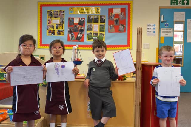 Some of the Sion children with pictures and messages for their friends at nearby St Mary's Residential Care Home