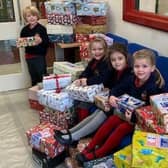 Children with some of the shoeboxes at St Philip’s Catholic Primary School in Arundel
