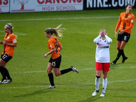 Megan Mackey of Lewes reacts after hitting the post in final play during the Barclays Fa Women's Championship match between London Bees and Lewes at The Hive