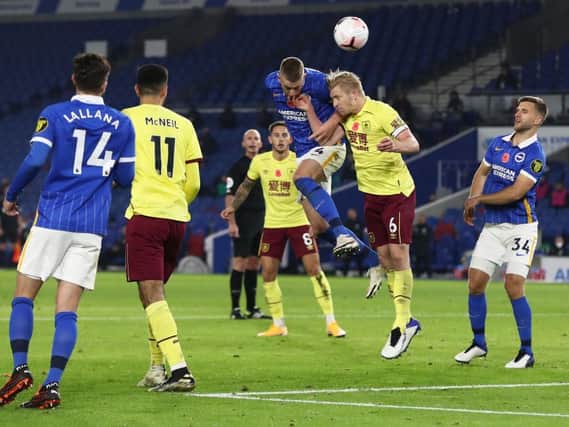 Adam Webster goes up for a header in Brighton's 0-0 draw with Burnley at The Amex