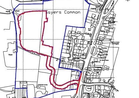 The wider development site in blue, the parcel in question in red