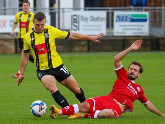 Jack Powell challenges during the 1-1 draw  with Harrogate Town. Picture by Matt Kirkham/Town Pix