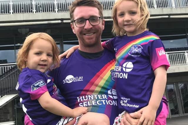 Tom Smith pictured with daughters Clara and Rosie - they are wearing the Rainbow Day kits worn when his Gloucesterhsire played Sussex 2019. The limited  edition shirts and caps were sold in aid of Grief Encounter with the shirts selling out online and in the club shop on the day with 100% of proceeds going to the charity. They raised more than 10,000.