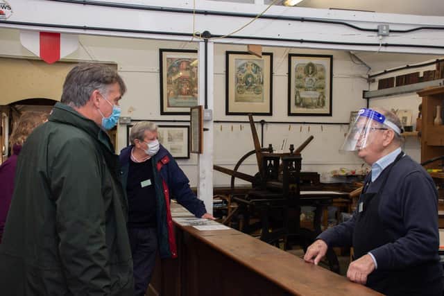 Dr Tim Fooks, High Sheriff of West Sussex, with Peter Scarratt in the print shop at mberley Museum. Picture: Pete Edgeler