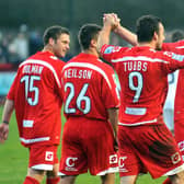 Crawley Town players celebrate one of Matt Tubbs' hat-trick