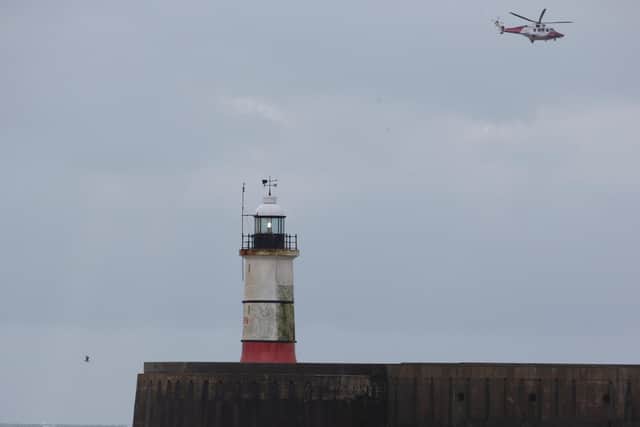 A Coastguard helicopter joined the search. Photo: Eddie Mitchell