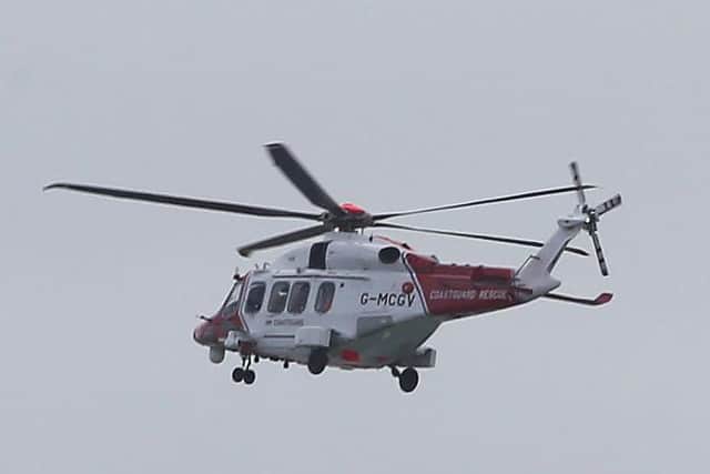 A Coastguard rescue helicopter joined the search. Photo: Eddie Mitchell