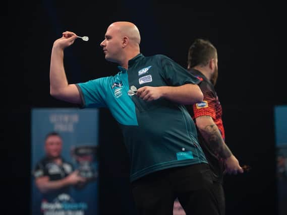 Rob Cross in action at the Grand Slam of Darts / Picture: Lawrence Lustig - PDC
