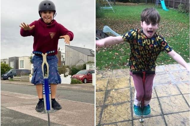 Solomon Nicholson, eight, and his cousin Jacob Anderson, nine, are bouncing 30,000 times on their pogo sticks