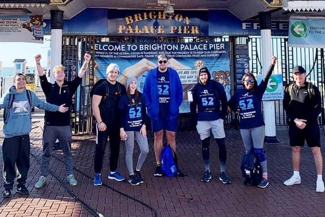 The MenWalkTalk 52 Mile Ruck team at Brighton Palace Pier