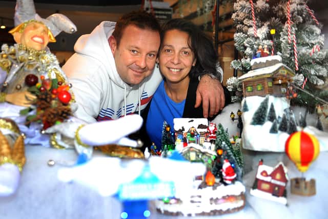 Marek and Rossella Raciti with their Christmas window at Carmela Deli, Horsham. Pic Steve Robards  SR2011246 SUS-201124-150748001