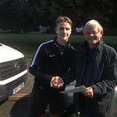 Ethan Robb, pictured with club secretary Simon Cook when he signed in the summer