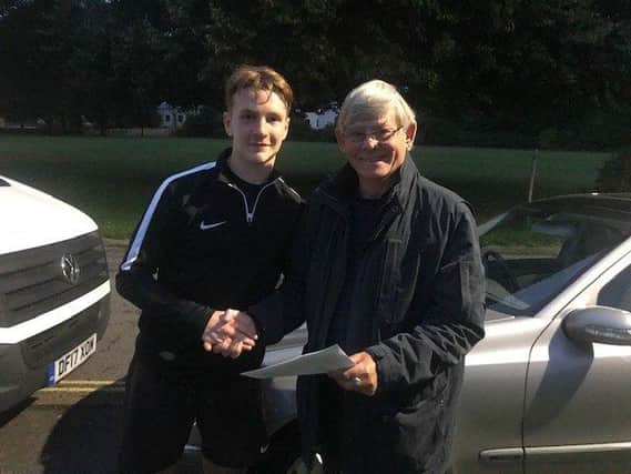 Ethan Robb, pictured with club secretary Simon Cook when he signed in the summer