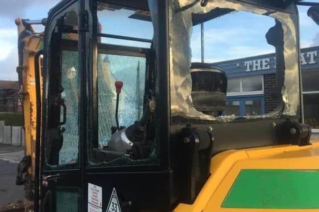 The windows on the digger, on the nearby promenade, were found smashed