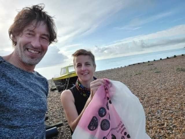 Danny Garbett and Dawn Bamworth clear litter from the beach