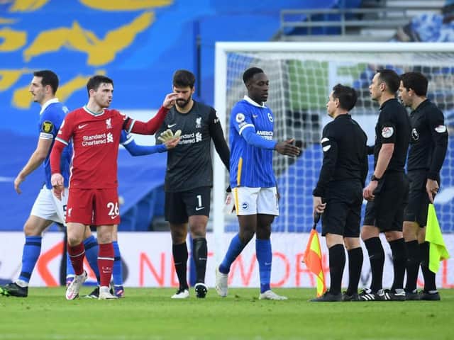 Liverpool's Adny Robertson makes his feelings known after Brighton's late penalty at the Amex Stadium