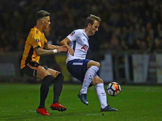 Ben White in FA Cup action for Newport County against Tottenham's Harry Kane in 2018