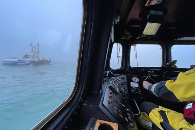 Newhaven RNLI crews approach the vessel in thick fog. Picture: RNLI Crew / Alex Beckett