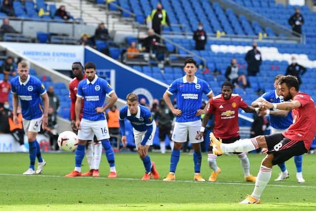 Manchester United's Bruno Fernandes slots home a penalty in the 10th minute of injury-time against Brighton