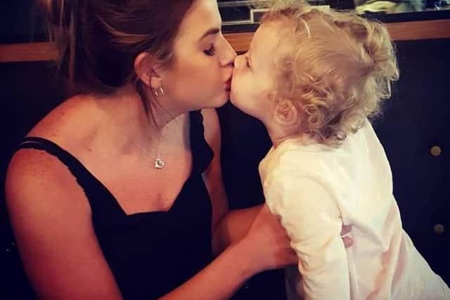 Little Tiffany Lothian kisses her organ donor and cousin Fern