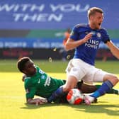 Brighton's Tariq Lamptey and Leicester Jamie Vardy tussle for possession