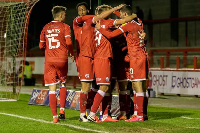Crawley Town players celebrate Max Watters' hat-trick goal. Picture by Jamie Evans Photography