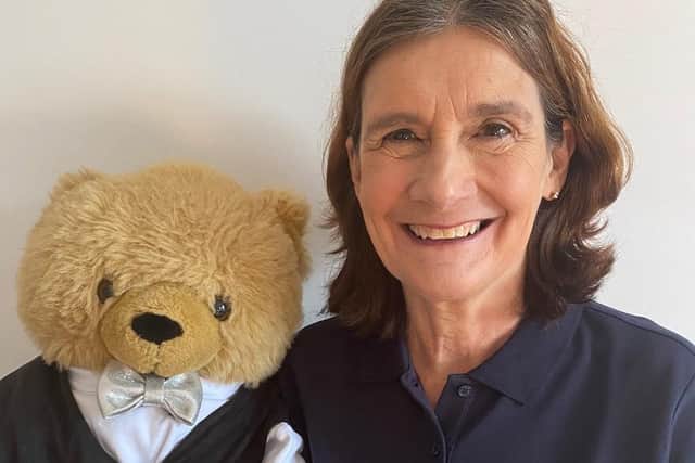 FHT Fellow, Mary Atkinson, accompanied by her trusty teddy, Emmanuel, with her 2020 FHT Complementary Therapist of the Year award.