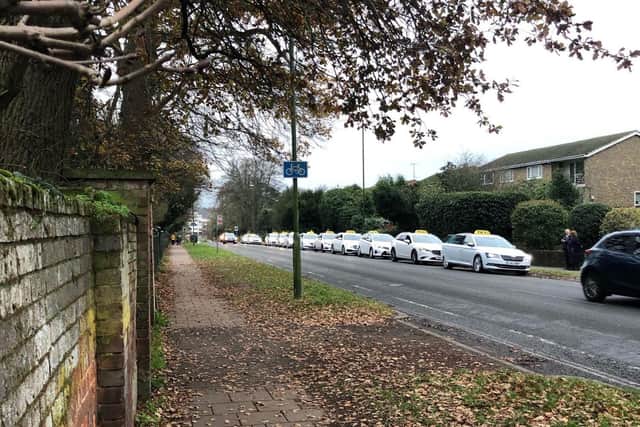A convoy of taxis at the funeral of taxi driver Carol Marsh