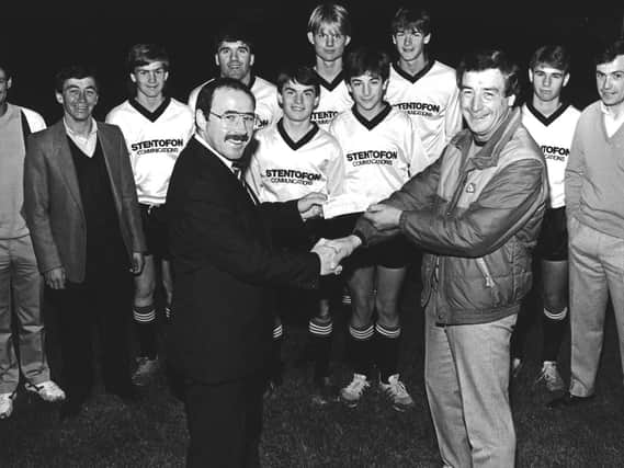Tony is picture with the late Kenny Turner, with players and club officials, after sponsoring Maple Leaf FC.