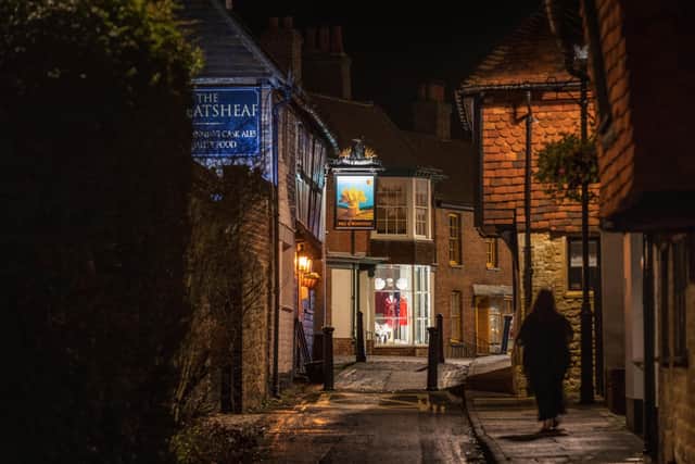 Late night Christmas shopping in Midhurst. Photograph by Christopher Ison. SUS-201216-124504001