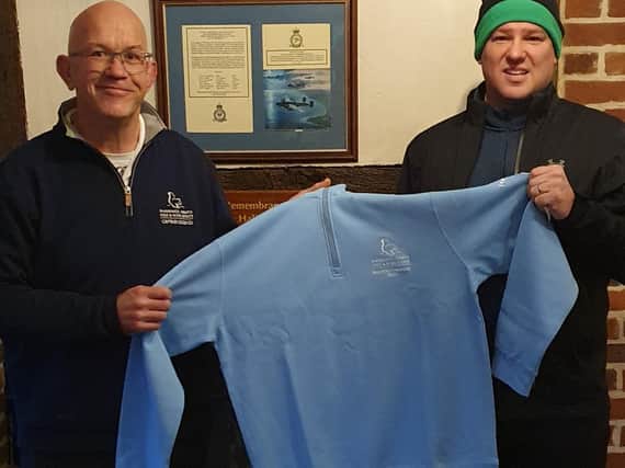 Chris McGrath presents Adrian Smale with his special top for winning the club’s Masters event