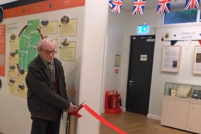 Harry Clark cuts the ribbon to officially open the new exhibition at Rustington Museum about his life