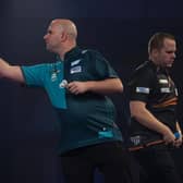 Rob Cross in action against Dirk van Duijvenbode / Picture: Lawrence Lustig - PDC
