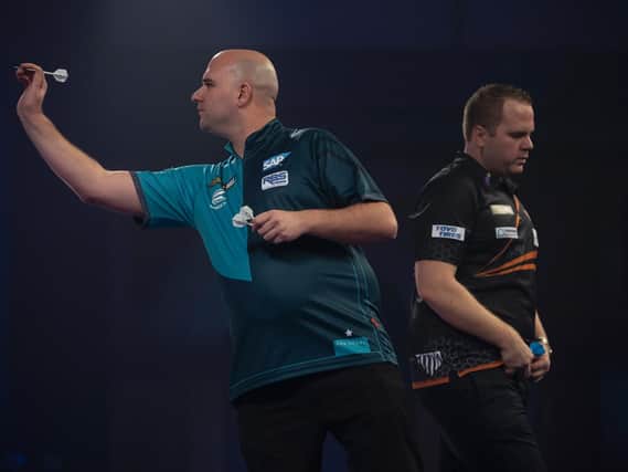 Rob Cross in action against Dirk van Duijvenbode / Picture: Lawrence Lustig - PDC