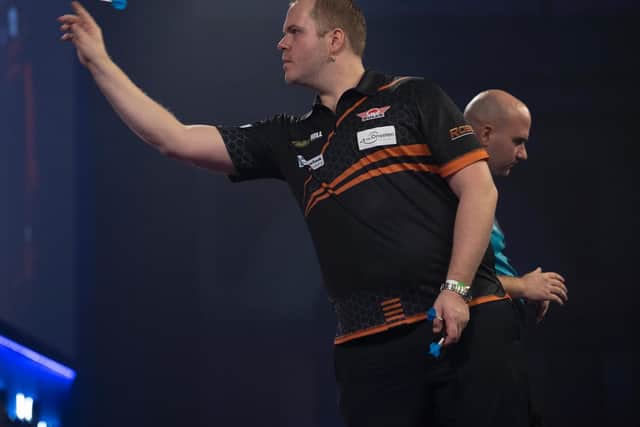 Rob Cross waits his turn / Picture: Lawrence Lustig - PDC