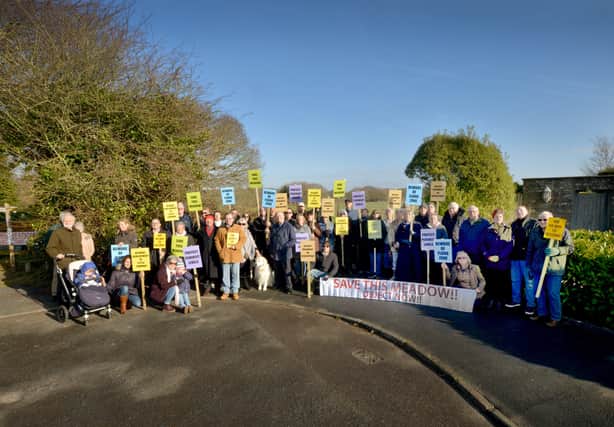 Residents of Clavering Walk, Cooden, protesting in February 2019 over Bellway's plans.

Pictured at the entrance of the proposed site. SUS-190220-103633001